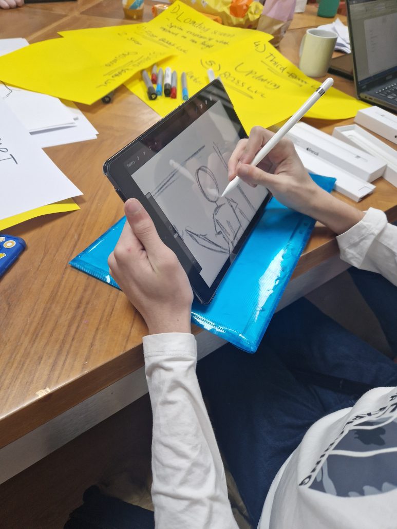 Someone drawing on a tablet